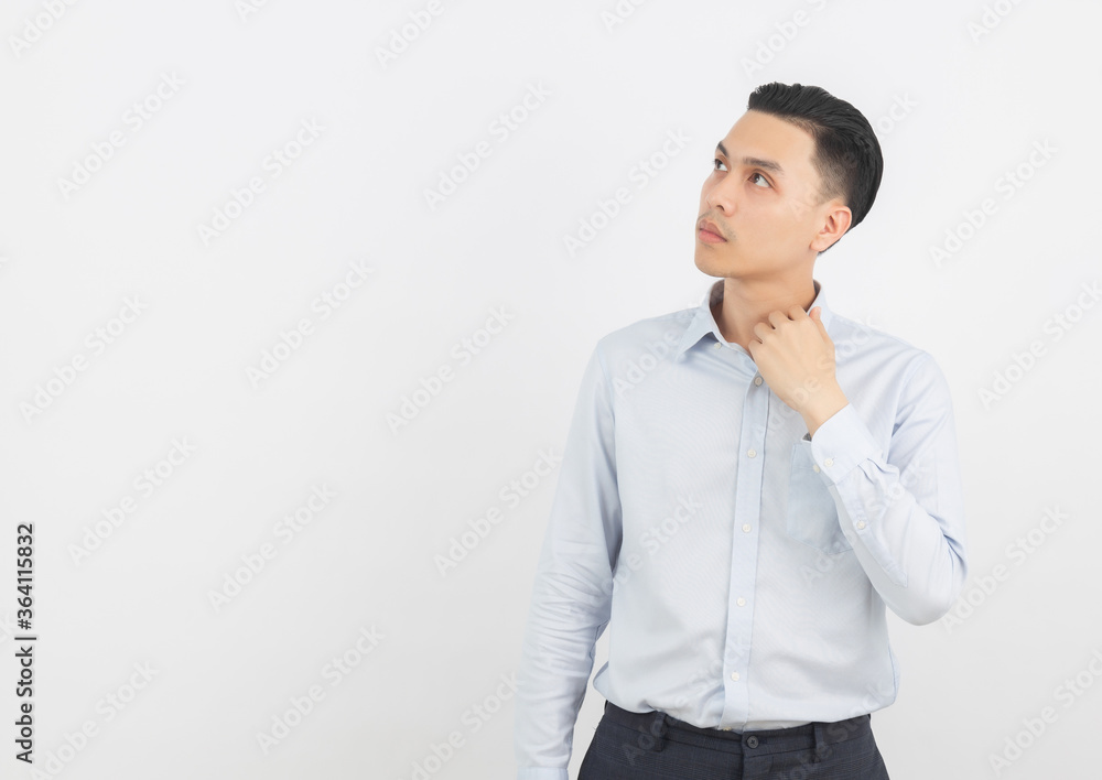 Young handsome asian business man thinking an idea while looking up isolated on white background. Young handsome asian business man thinking an idea while looking up isolated on white background.