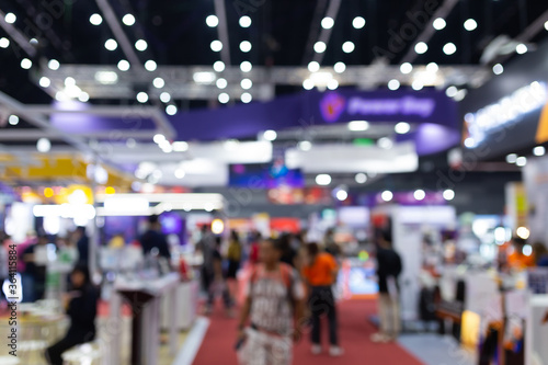 Abstract blur people in exhibition hall event trade show expo background. Business convention show, job fair, or stock market. Organization or company event, commercial trading. © Touchr