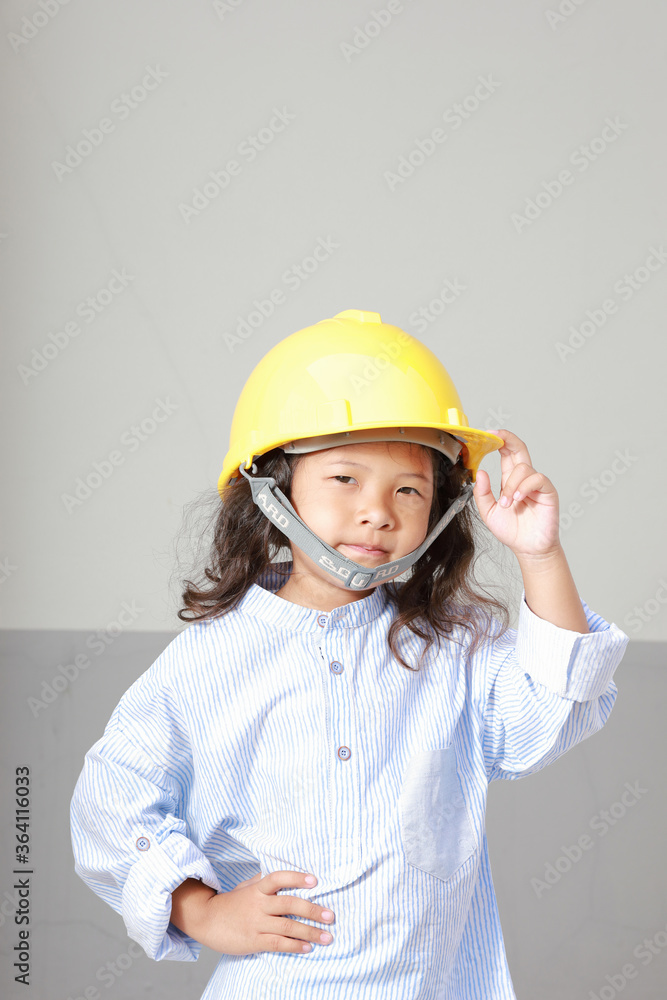 Education concept, Asia kid girl posing in engineers dress. Education concept, Asia kid girl posing in engineers dress.