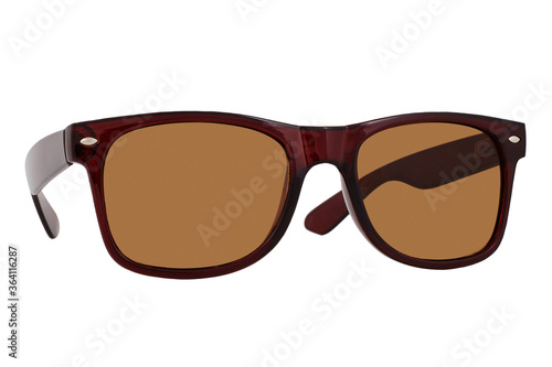 Obraz na płótnie Sunglasses with a brown plastic frame and brown lenses isolated on white background. w salonie