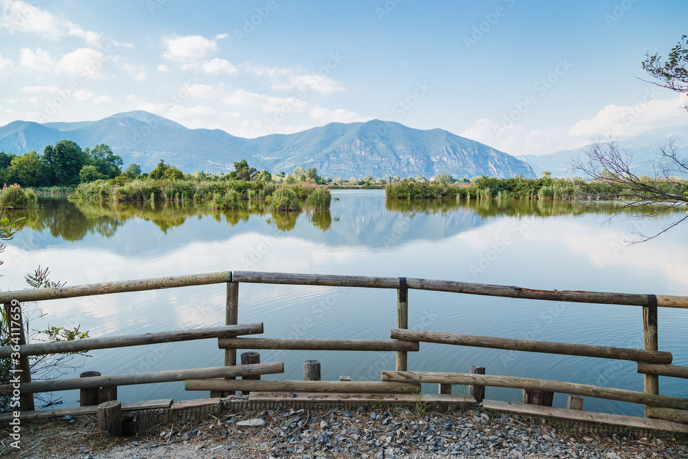 Torbiere del Sebino nature reserve in the province of Brescia on a sunny day with clouds Torbiere del Sebino nature reserve in the province of Brescia on a sunny day with clouds