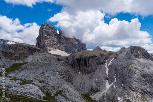 Amazing rocky mountains covered with clouds, Tre Cime di Lavaredo park, Dolomites, Italy