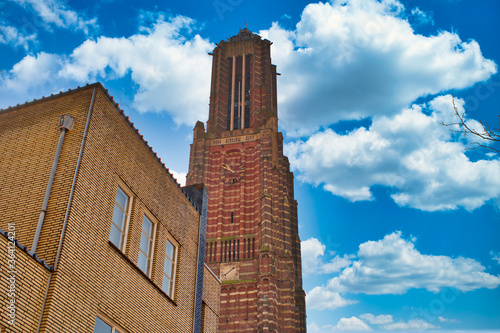 A part from the Martinus church in Weert the Netherlands with a cloudy and blue sky photo