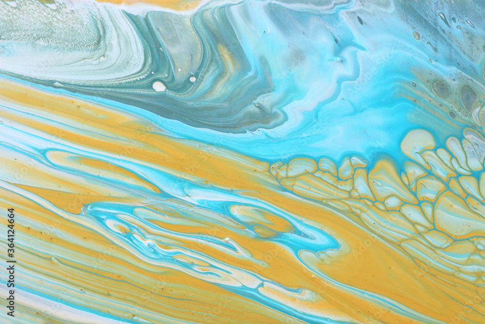 art photography of abstract marbleized effect background. Blue and gold creative colors. Beautiful paint.