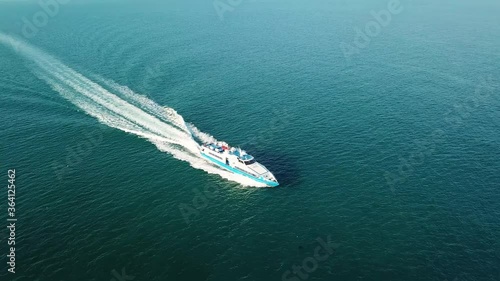Wallpaper Mural Aerial zoom in shot of boat speeding through waters  Nongsa Batam Indonesia Torontodigital.ca