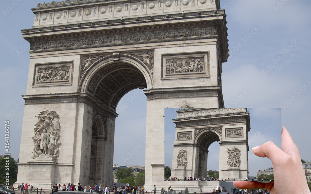 Fototapeta premium hand with photography compares with the original