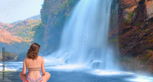 Beautiful girl in bikini looking at waterfall - Upper Kapuzbasi waterfall - Kayseri Turkey