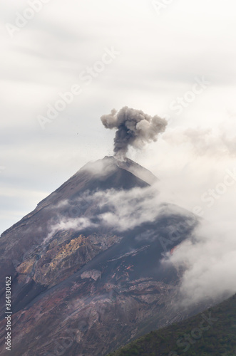 Volcano Fuego in Guatemala erupting with ashes and rocks during an evening. View from Acatenango summit