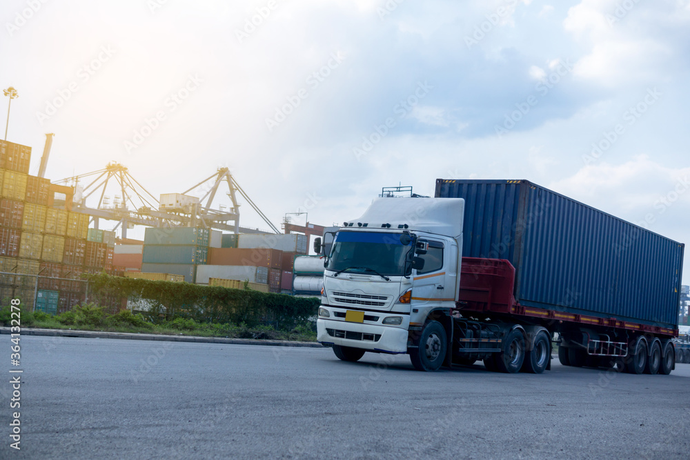 Container blue truck in ship port Logistics.Transportation industry in port business concept.import,export logistic industrial Transporting Land transport freight warehouse storge Container blue truck in ship port Logistics.Transportation industry in port business concept.import,export logistic industrial Transporting Land transport freight warehouse storge