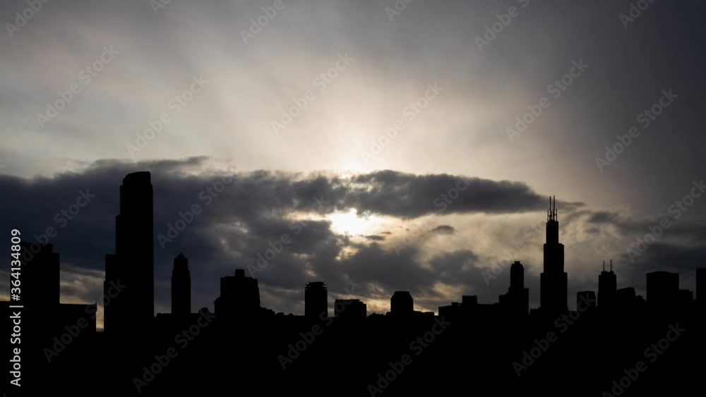 Chicago: Time Lapse at Sunrise with Fast Clouds and Dark Skyline of American Metropolis, Illinois, USA Chicago: Time Lapse at Sunrise with Fast Clouds and Dark Skyline of American Metropolis, Illinois, USA