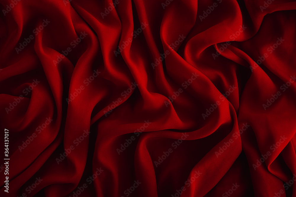 Obraz premium Red fabric texture. Dark abstract background for design. Close up, copy space, top view