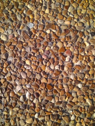 Custom masonry walls made of sand and small stones.