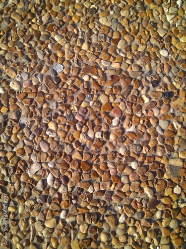 Custom masonry walls made of sand and small stones.