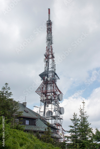 Skrzyczne, Poland, July 04, 2020: Peak, with a tourist hostel, meteorological station and telephony tower and chair lift station in Beskid Slaski Mountains