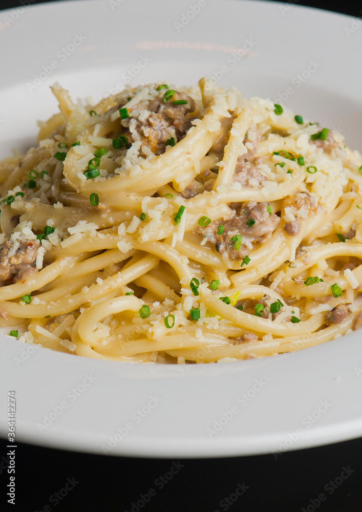 Pasta with meatballs, marinara sauce, Parmesan cheese and fresh Italian parsley. Classic American or Italian restaurant favorite. Homemade pasta with sauces, meats and cheeses.