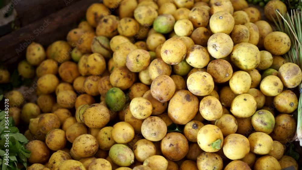 Fresh yellow lemon limes for sale at vegetable market Fresh yellow lemon limes for sale at vegetable market