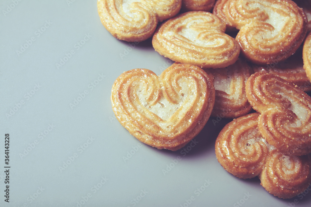 Homemade heart shaped sugar biscuit on gray background Homemade heart shaped sugar biscuit on gray background