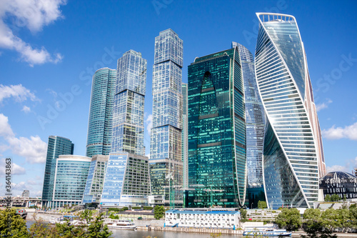 Cityscape of Moscow city with skyscrapers of Moscow International Business Center (MIBC). Blue sky with few clouds on a summer morning. Modern office buildings theme. photo