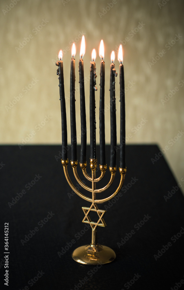 Menorah with dark candles, rituals and magical time Menorah with dark candles, rituals and magical time