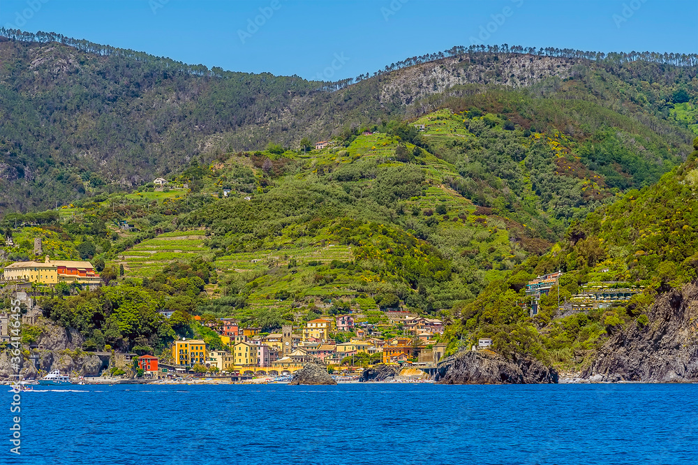 A view from the sea of the Cinque Terre village of Monterosso in the summertime