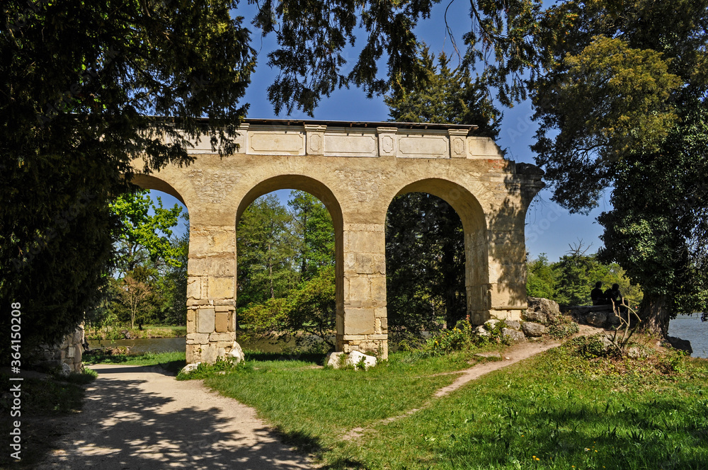 Old stone viaduct in the castle garden of Lednice castle