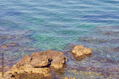 Rocky sea coast of Kolimvari in Crete Greece with turquoise water as a natural background. Copy space. photo