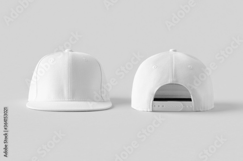 Photography White snapback caps mockup on a grey background, front and back side