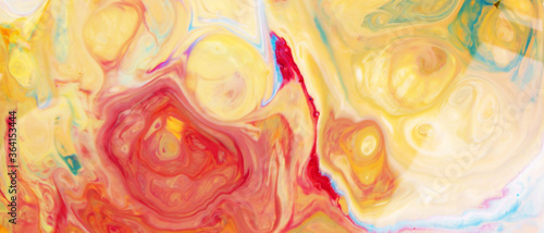 Fluid Art. Abstract blurred multi-colored background. Swirl liquid pattern. Trendy colorful backdrop. Mixing paints
