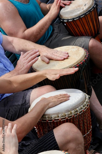 Tam-Tams drum circle with djembe in Mount Royal Park, Montreal, Quebec, Canada. An outdoor summer music festival held on weekends. photo