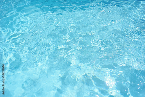 Blue water texture with chlorine in the pool.
