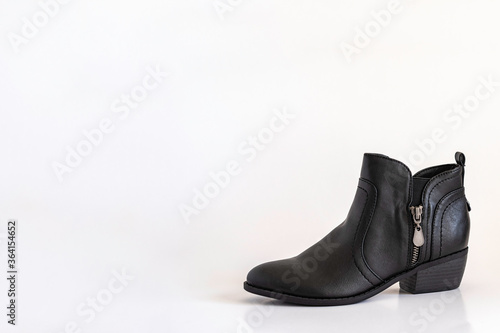Cowboy boot on white background with copy space.