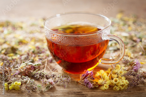 Cup of herbal tea with dried herbs