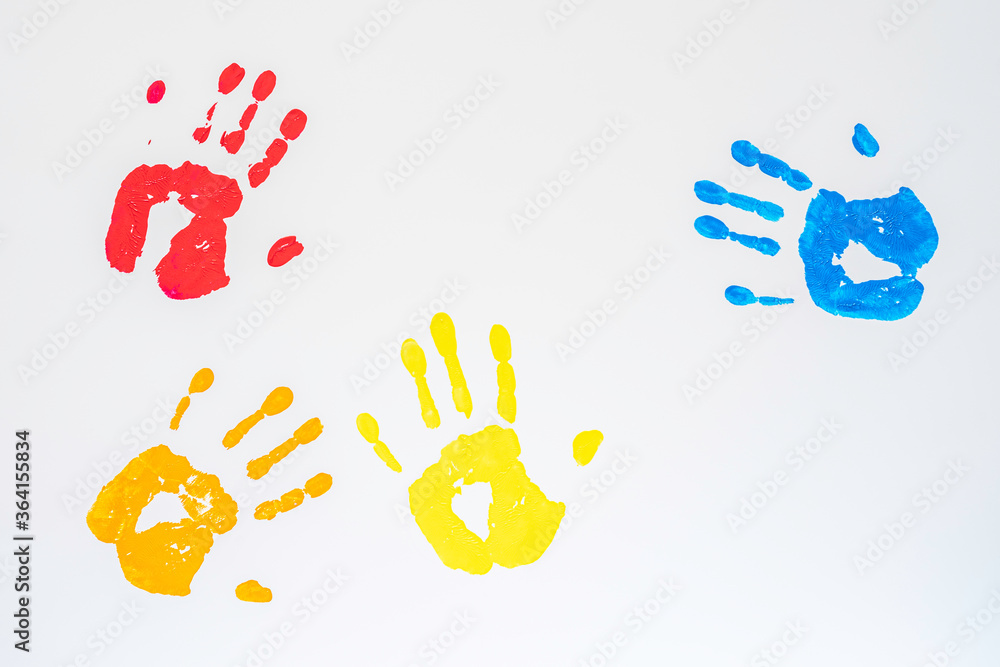 Handprints in various colours on white background. Handprints in various colours on white background.