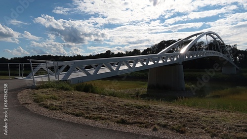 New arch footbridge between Czech Republic and Slovakia across river Morava, near towns of Mikulcice and Kopcany, built in 2019. photo