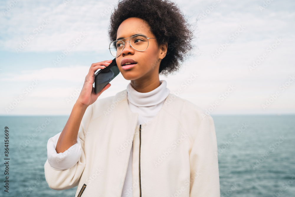 Latin woman talking on the phone. Latin woman talking on the phone.