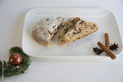 Christmas stollen and Christmas decoration on a white base