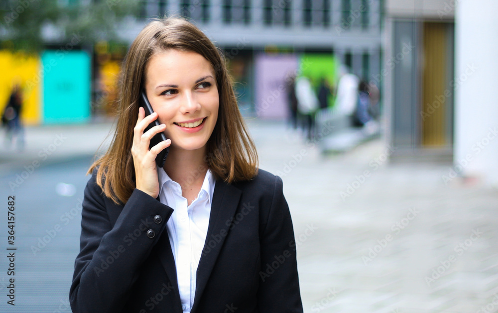 Portrait of a young woman talking on the phone