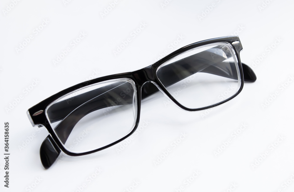 Glasses of black color on a white background close-up. Isolate Glasses of black color on a white background close-up. Isolate