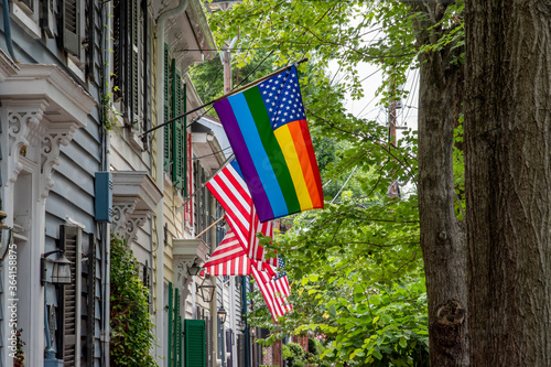 Old Town Alexandria, Virginia / USA - July 11 2020: American flag fused with LGBT pride flag displayed at home in the historic district.