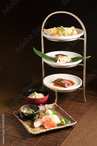 gourmet Japanese or asian omakase lunch set with raw fish sashimi, deep fried tempura, grilled steak, meat and vegetables