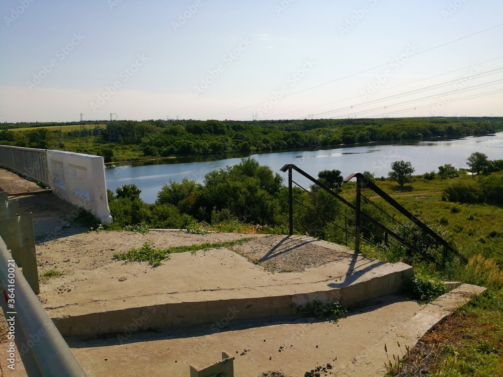 Fototapeta premium Landscape with a wide calm flat river