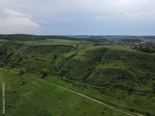 Aerial view of green hills on a cloudy day