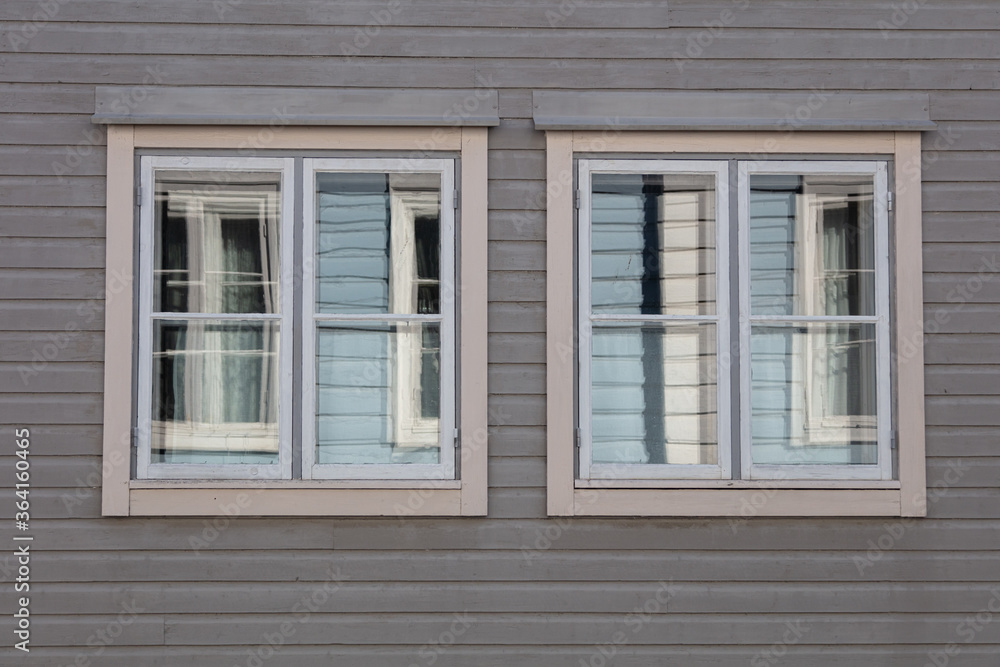 Background. Windows in a wooden house. Scandinavian architecture, old houses. Finland.