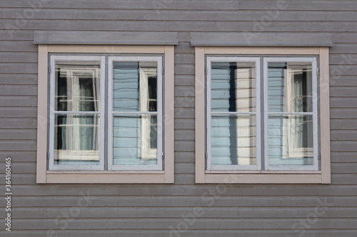 Background. Windows in a wooden house. Scandinavian architecture  old houses. Finland.