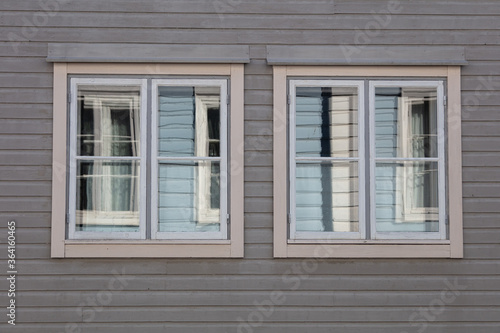 Background. Windows in a wooden house. Scandinavian architecture, old houses. Finland.