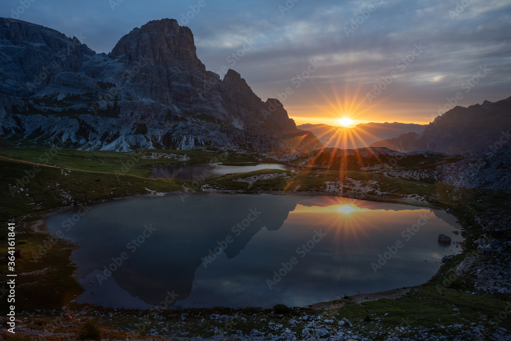 Sunrise on lake on tre cime di lavaredo Dolomites Italian alps - obrazy, fototapety, plakaty 