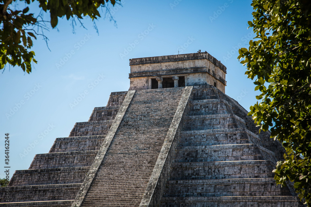 Travel Mexico background - Anicent Maya mayan pyramid El Castillo (Kukulkan) in Chichen-Itza, Mexico Travel Mexico background - Anicent Maya mayan pyramid El Castillo (Kukulkan) in Chichen-Itza, Mexico