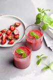 Sweet strawberry mousse with mint leaves and fersh berries, delicious summer dessert