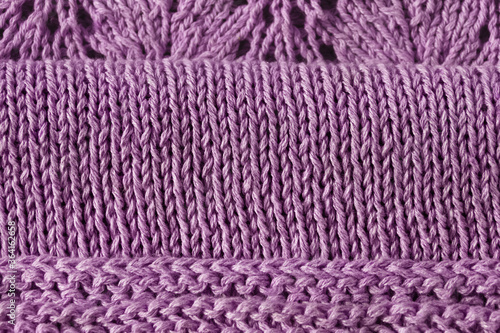 knitted cotton knitting fabric for baby dress with satin stitch violet-colored dress with lace coquette on right on lilac background