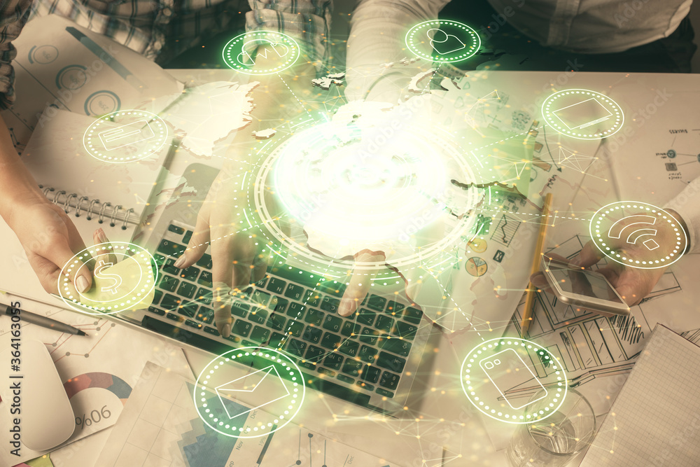 Double exposure of man and woman working together and social network theme hologram drawing. Computer background. connecting concept. Top View. Double exposure of man and woman working together and social network theme hologram drawing. Computer background. connecting concept. Top View.